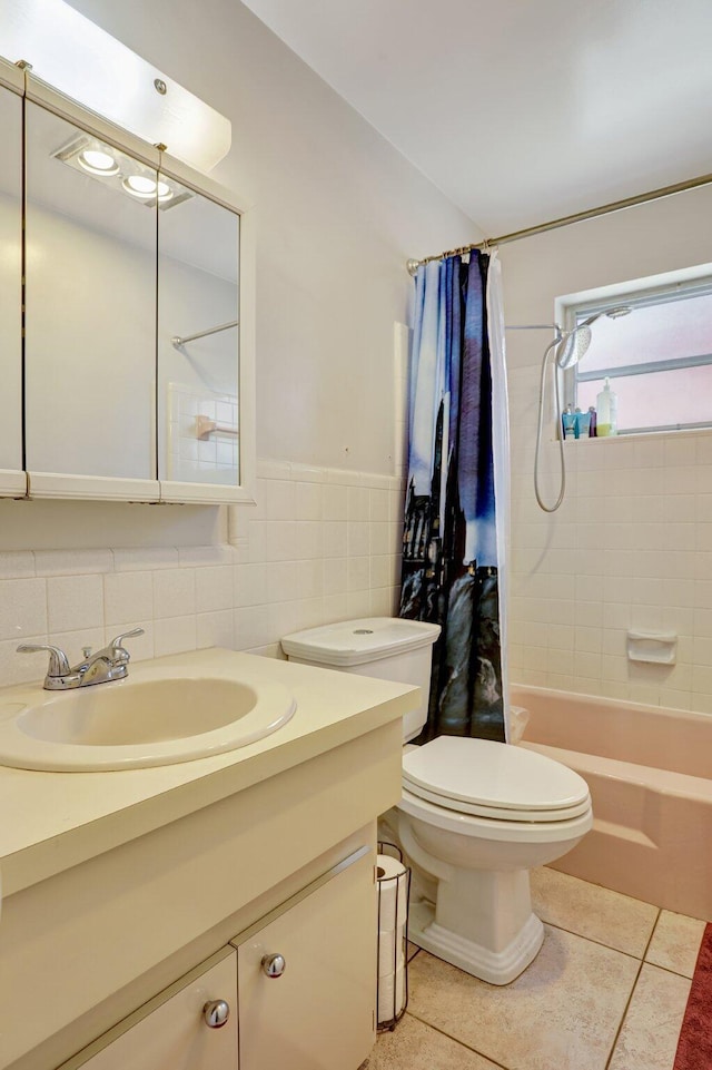 full bathroom with toilet, shower / tub combo, tile walls, vanity, and tile patterned flooring