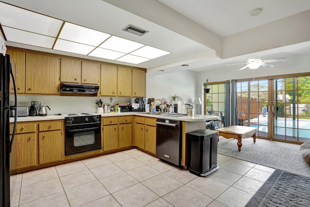 kitchen with light tile patterned floors, black appliances, kitchen peninsula, and ceiling fan