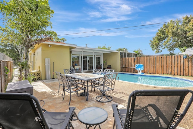 view of pool featuring a patio