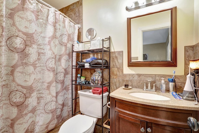 bathroom featuring vanity, tile walls, walk in shower, and toilet