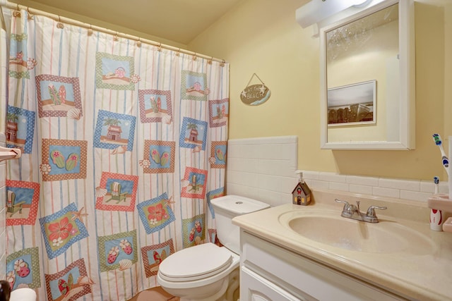 bathroom with vanity, walk in shower, and toilet