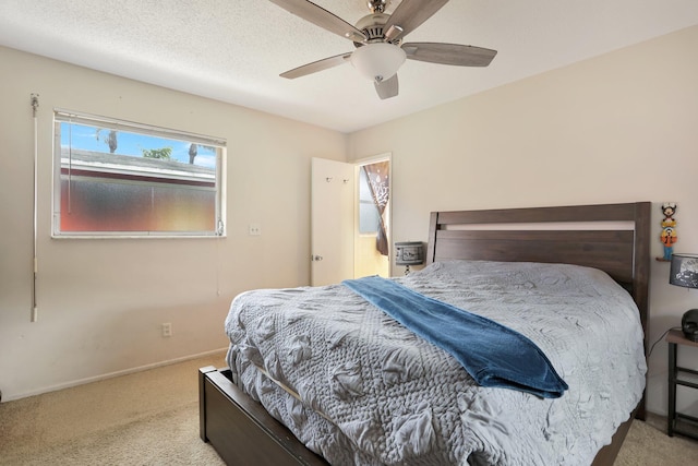 bedroom featuring light carpet and ceiling fan