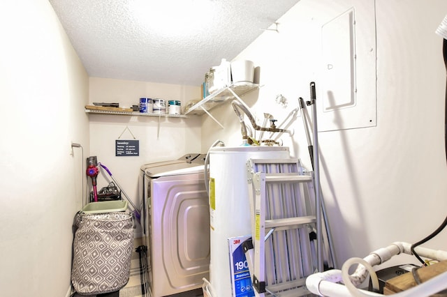 washroom featuring a textured ceiling, electric panel, independent washer and dryer, and gas water heater