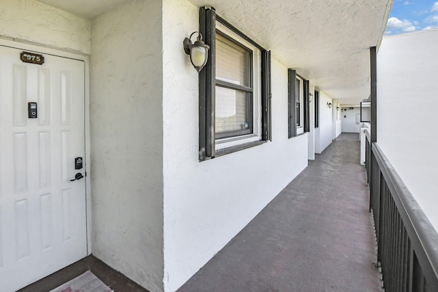 entrance to property with a balcony