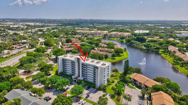 birds eye view of property with a water view