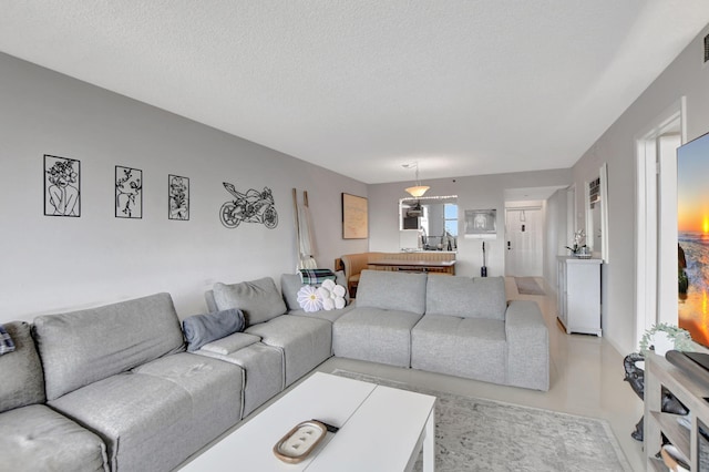 living room with a textured ceiling