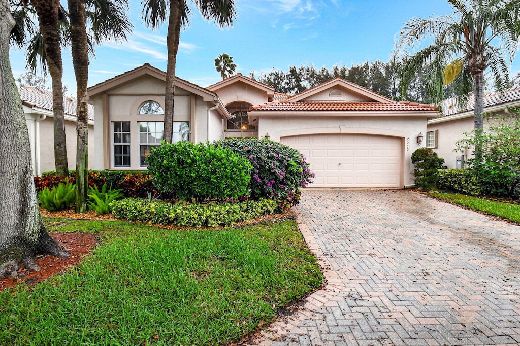 view of front of property with a garage