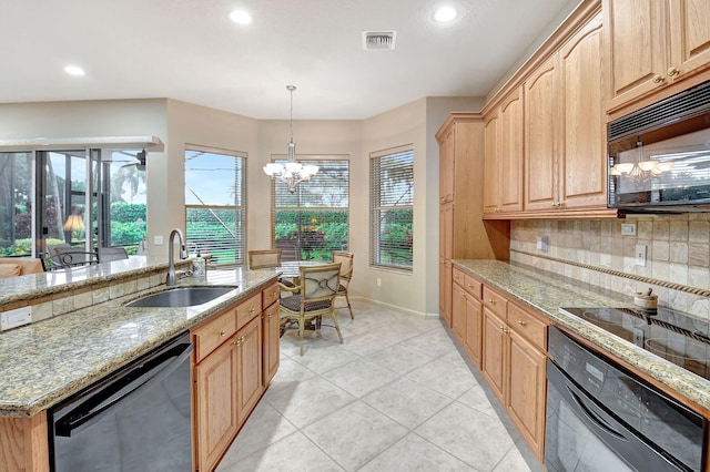 kitchen with black appliances, light stone countertops, decorative backsplash, sink, and decorative light fixtures