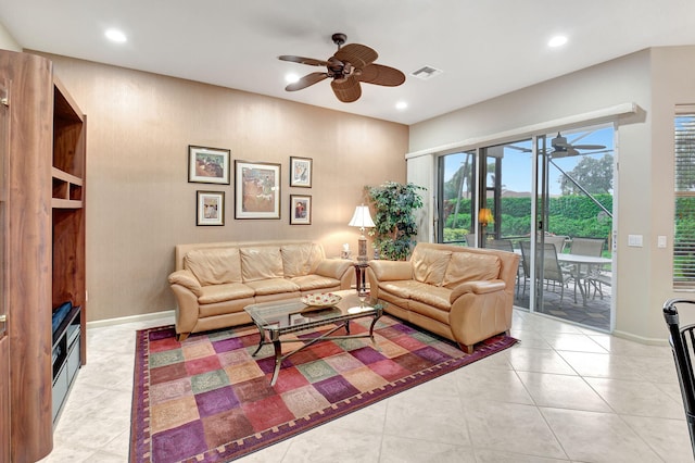 tiled living room with ceiling fan