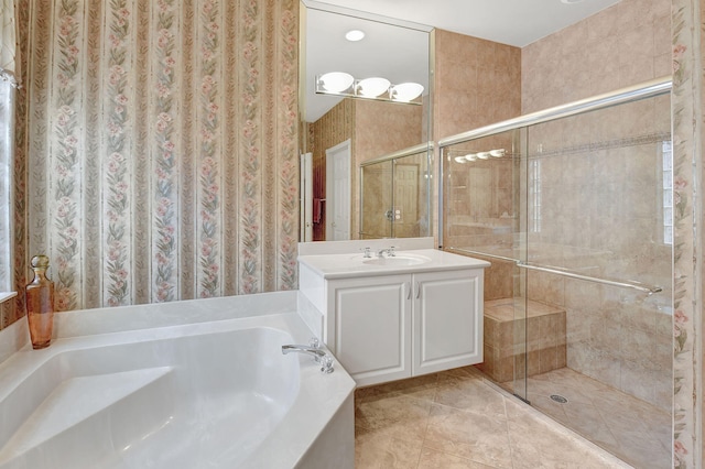 bathroom featuring vanity, shower with separate bathtub, and tile patterned flooring