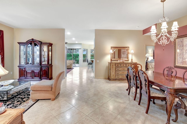 dining space featuring a chandelier and light tile patterned floors