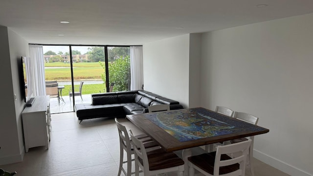 dining area with floor to ceiling windows