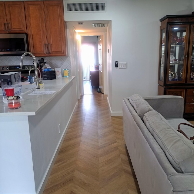 kitchen featuring decorative backsplash and sink