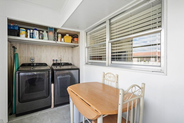 laundry room featuring washer and dryer and ornamental molding