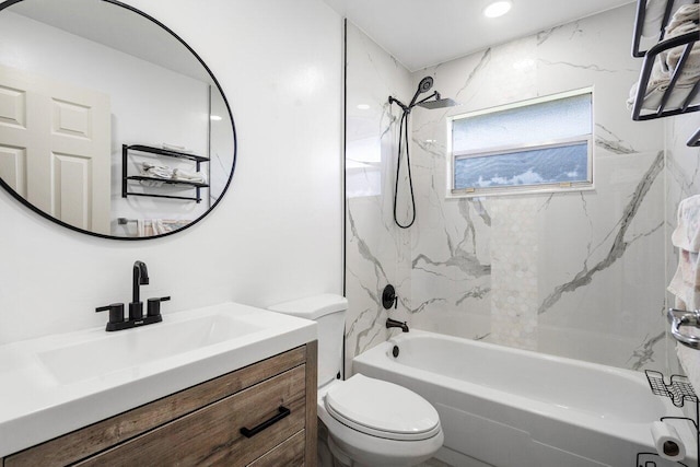 full bathroom with toilet, vanity, and tiled shower / bath combo