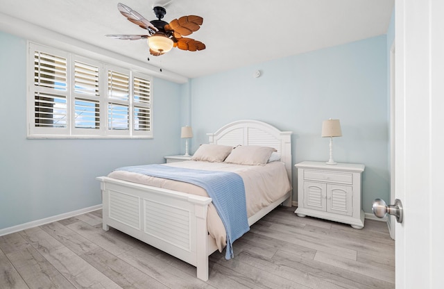 bedroom with ceiling fan and light wood-type flooring