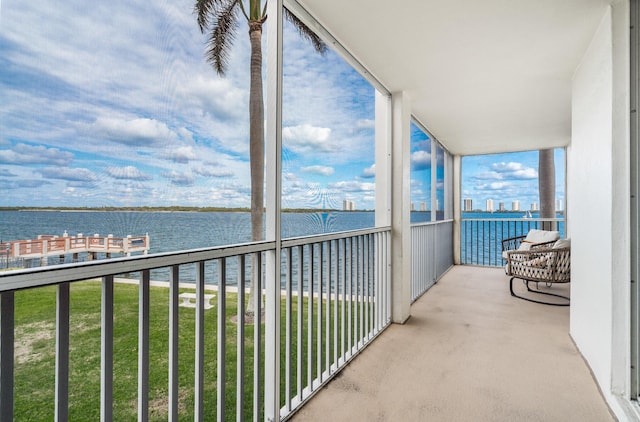 balcony featuring a water view