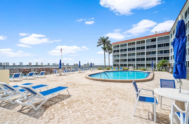 view of swimming pool with a patio