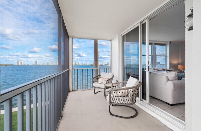 sunroom / solarium with a water view and plenty of natural light