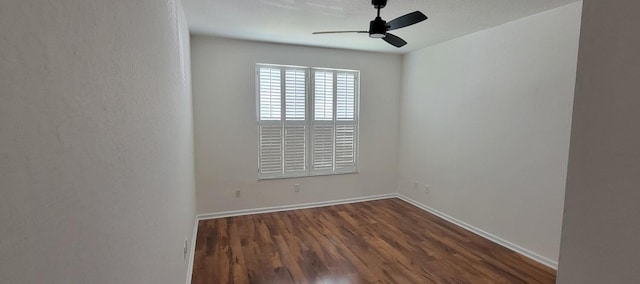 3569 Forest Hill Blvd Unit 103, Palm Springs, FL 33406 - empty room with dark wood-style flooring, a ceiling fan, and baseboards