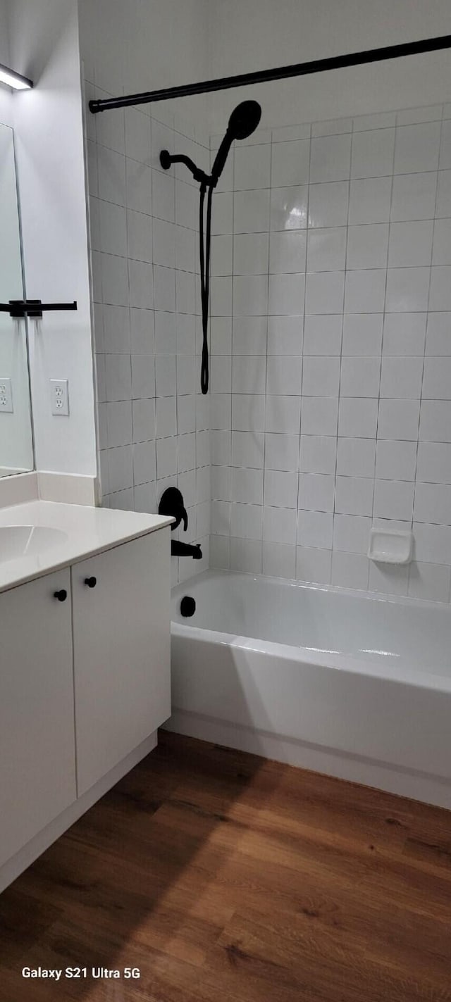 3569 Forest Hill Blvd Unit 103, Palm Springs, FL 33406 - bathroom featuring wood finished floors, bathtub / shower combination, and vanity