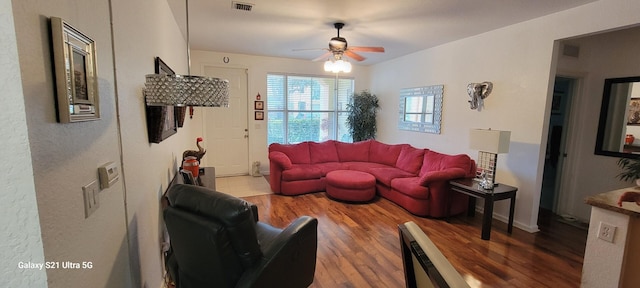 living room featuring hardwood / wood-style flooring and ceiling fan