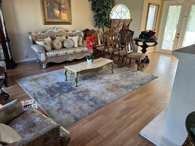 living room featuring wood-type flooring and french doors