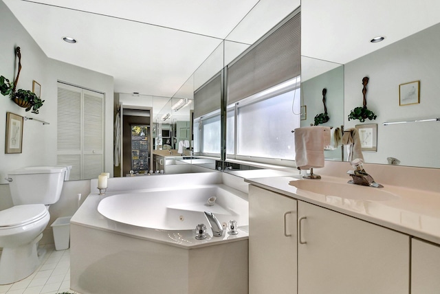 bathroom with vanity, tile patterned floors, and toilet