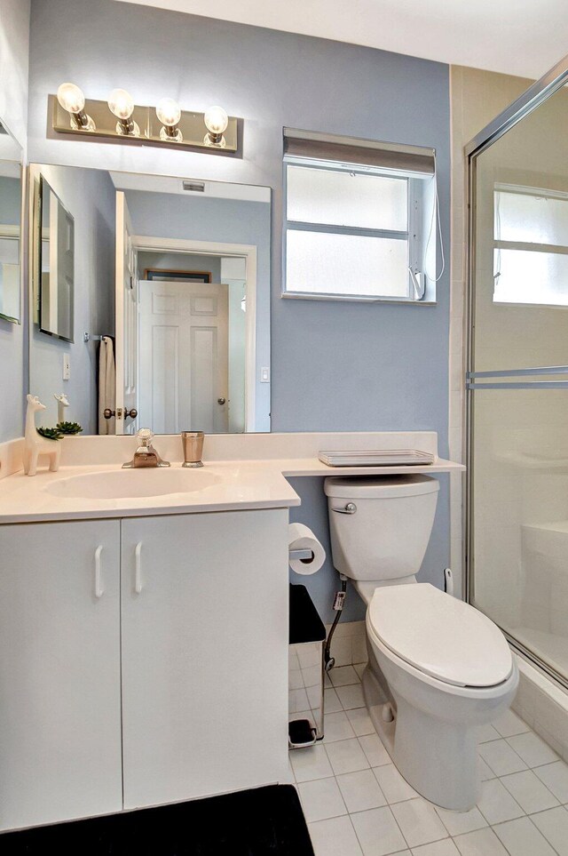 bathroom featuring a shower with shower door