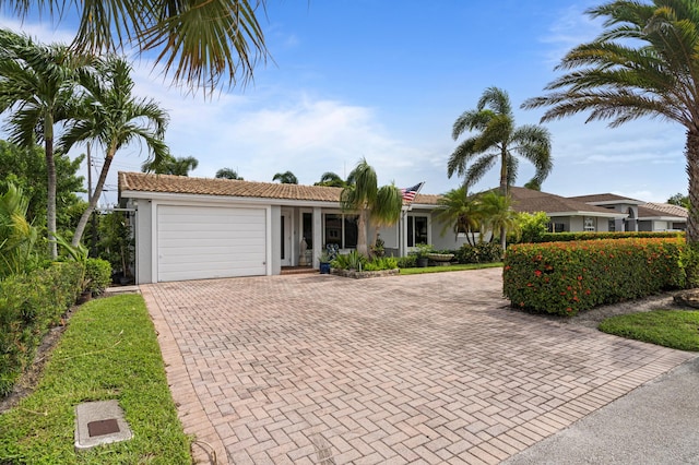 ranch-style home with a garage