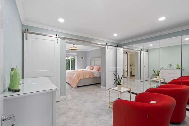 bedroom featuring crown molding and a barn door