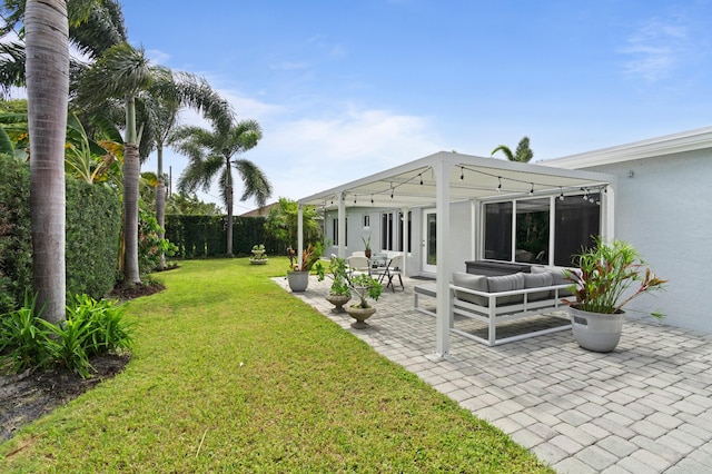 view of yard featuring a patio and outdoor lounge area