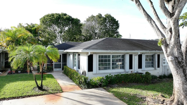 ranch-style house with a front yard