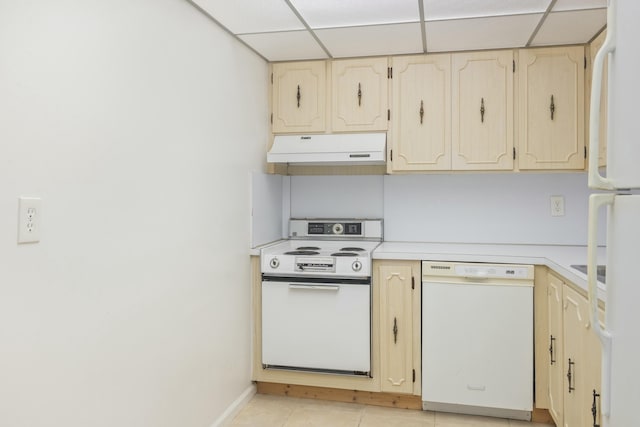 kitchen with white appliances and a paneled ceiling