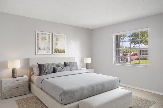 bedroom featuring light tile patterned floors