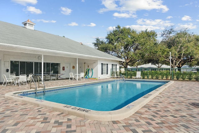 view of swimming pool with a patio