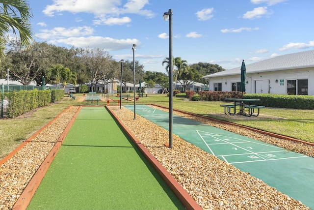 view of home's community with a yard