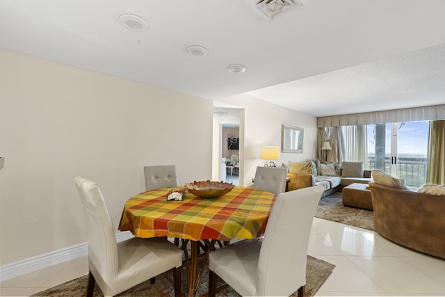 dining room featuring light tile patterned floors