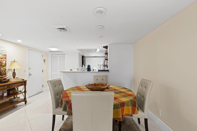 dining room featuring light tile patterned flooring