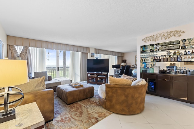 tiled living room with indoor bar and a textured ceiling