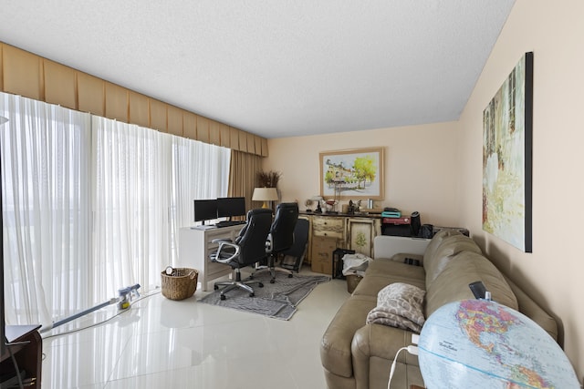 office area featuring tile patterned floors and a textured ceiling