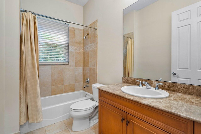 full bathroom featuring toilet, vanity, tile patterned floors, and shower / bath combination with curtain