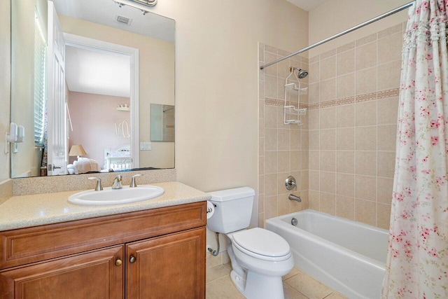 full bathroom featuring toilet, vanity, shower / tub combo, and tile patterned flooring