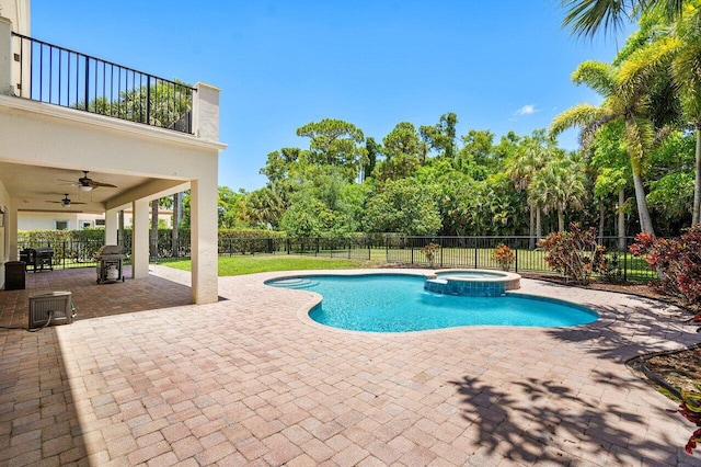 view of pool featuring ceiling fan, an in ground hot tub, and a patio