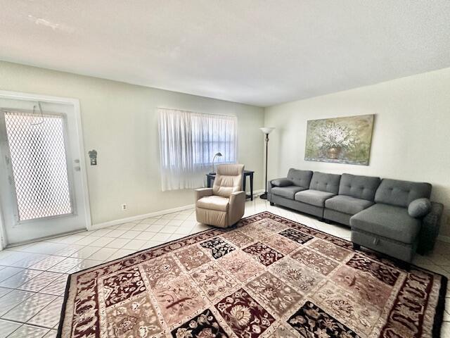 living room featuring light tile patterned floors