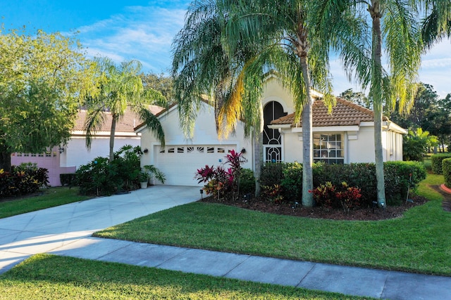 view of front of house with a garage and a front yard