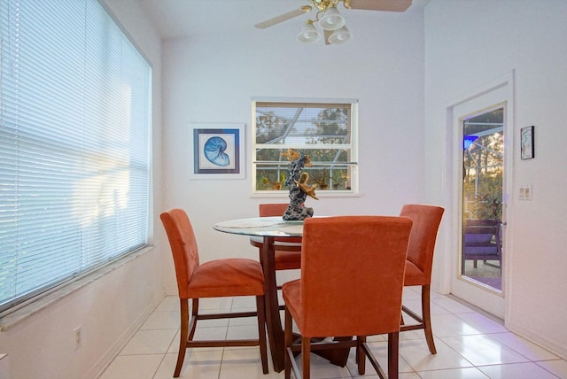 tiled dining area featuring ceiling fan