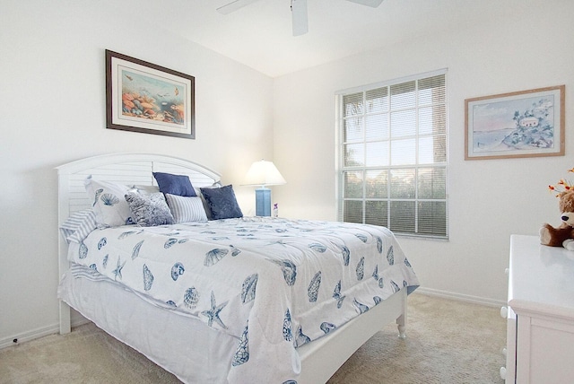 bedroom with ceiling fan and light colored carpet