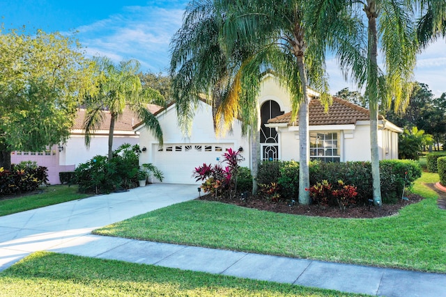 view of front facade featuring a front lawn and a garage