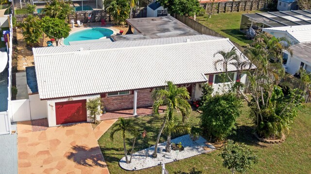 single story home with a garage and a front yard